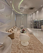 Large Foyer Lighting spiral raindrop crystal chandelier above a white spiral stair lounge