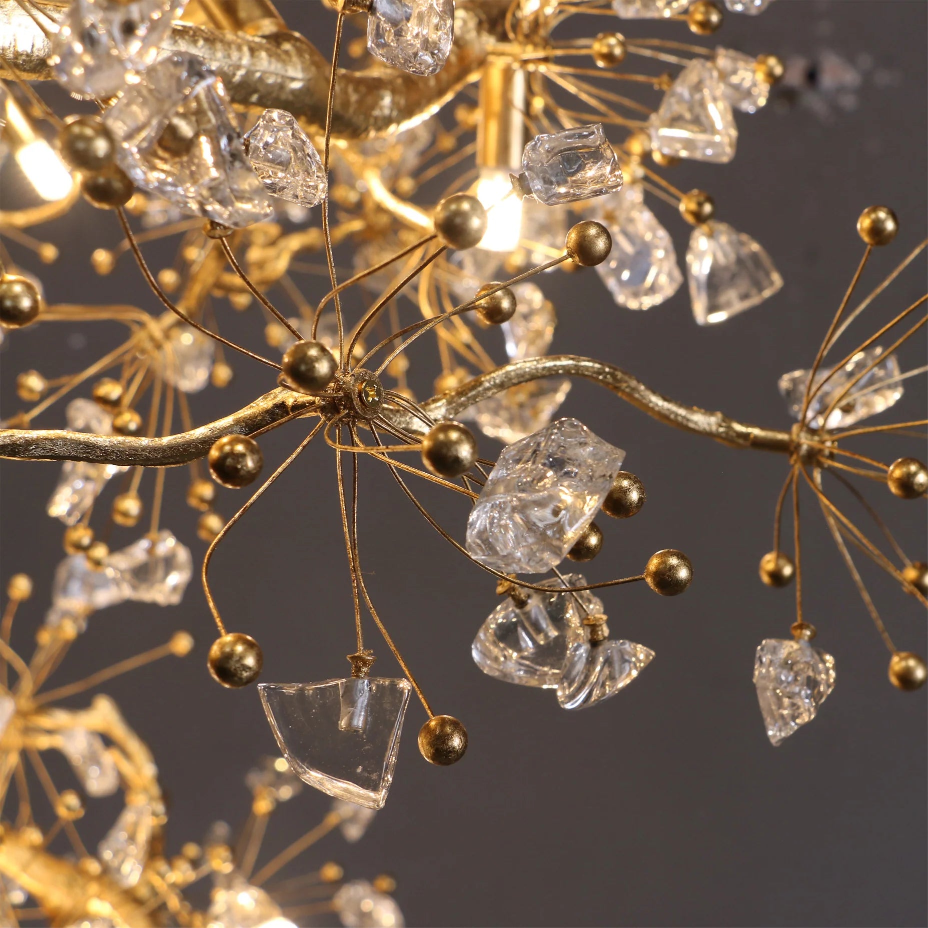 Detailed close up of Lorna chandelier glass berries on gold branch arms