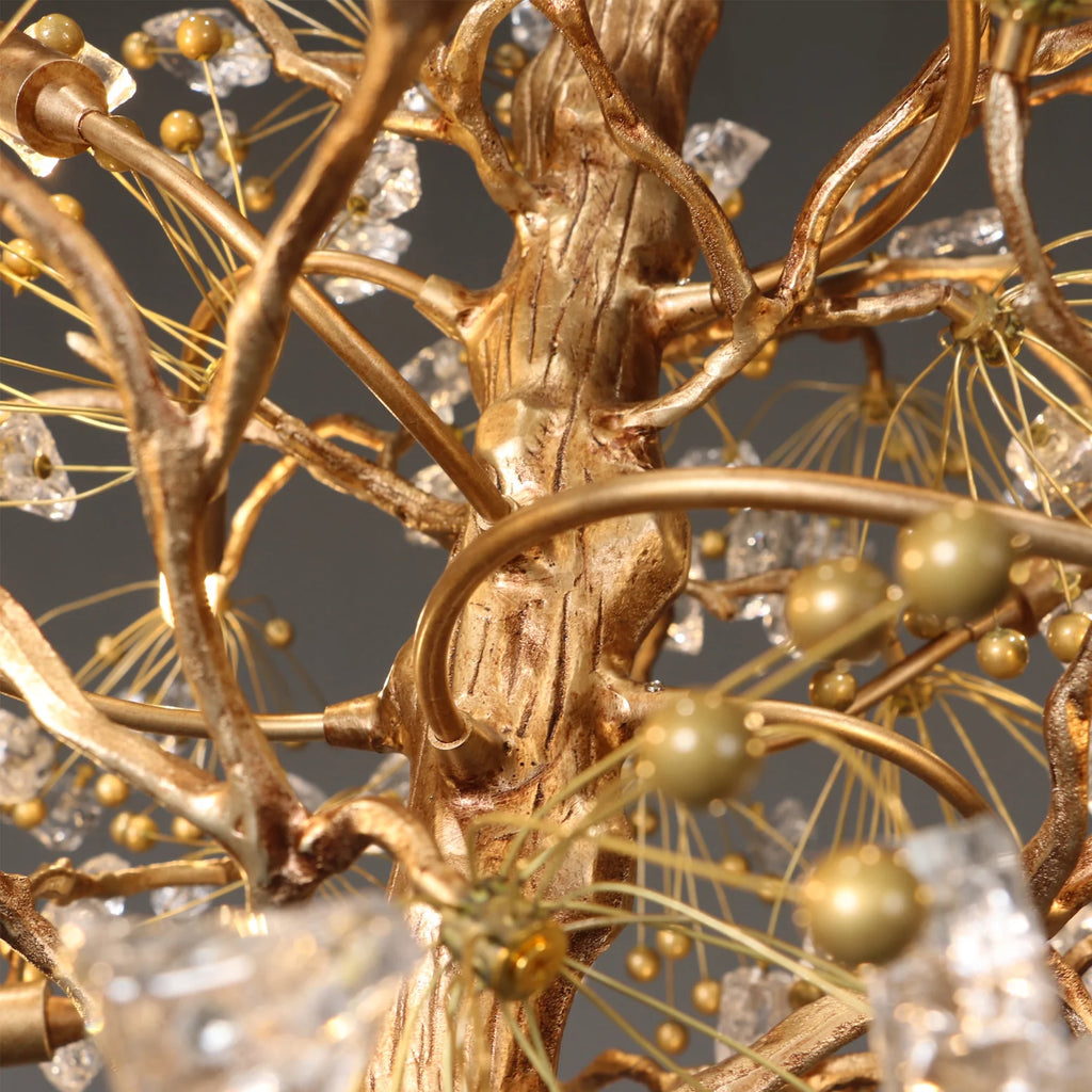 Close up of gold branch frame and glass berry accents on Lorna chandelier