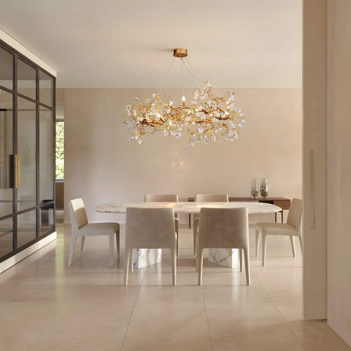 Lorna Berry Branch Shape Glass Chandelier above a minimal white dining table