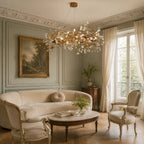 Lorna Berry Branch Shape Glass Chandelier lighting a soft neutral lounge area