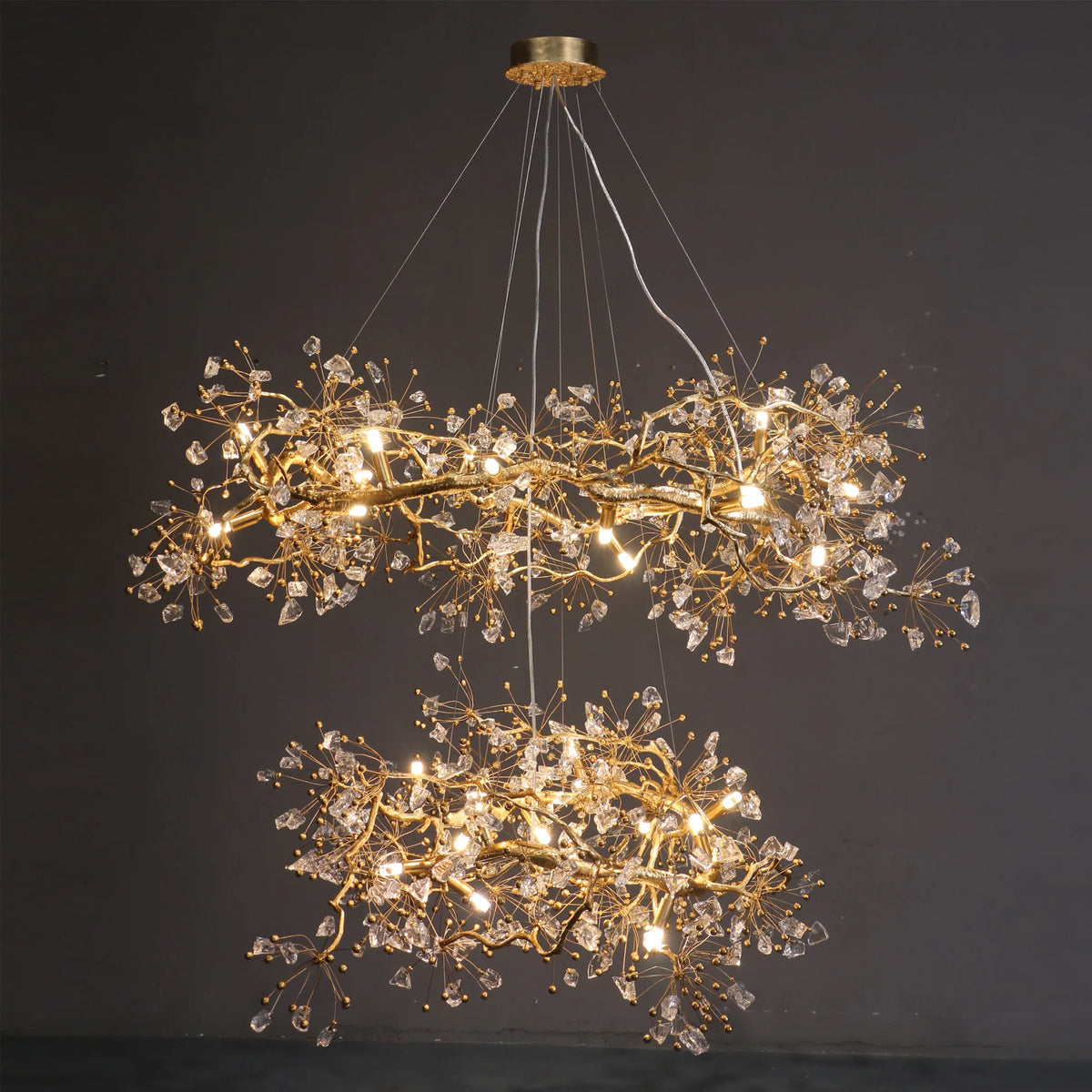 Side view of two tier Lorna Berry Branch Shape Glass Chandelier with warm lighting