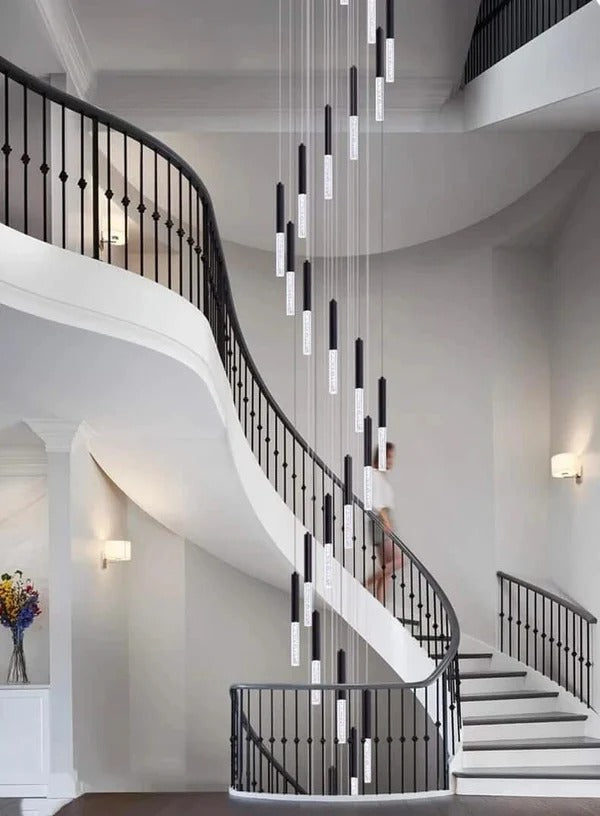 Lum Modern Black Foyer Chandelier For High Ceiling cascading through a grand staircase with black railings