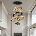Malen Multi Ring Pendant Light installed in a high ceiling living room with layered crystal rings