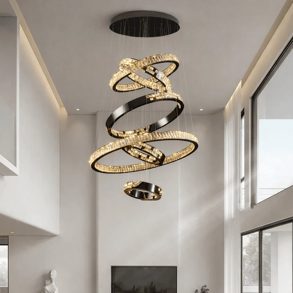 Malen Multi Ring Pendant Light installed in a high ceiling living room with layered crystal rings