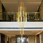Mina Crystal Entryway Light Fixtures High Ceiling installed in a tall modern interior with gold crystal rods