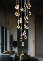 Modern Crystal Chandelier for High Ceiling Living Room shown as an artistic crystal pendant cluster in a modern living room