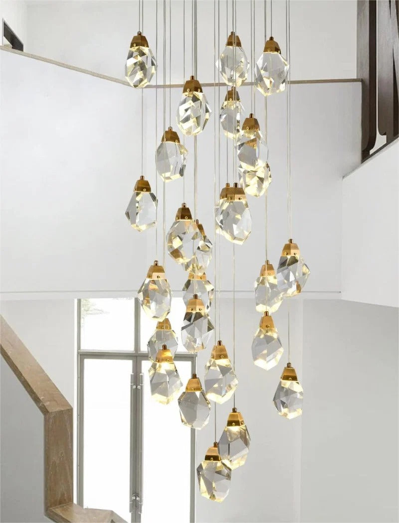 Modern Crystal Chandelier for High Ceiling Living Room with a large gold and crystal cluster in a white staircase