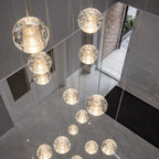 Modern Crystal Glass Bubble Chandelier for Foyer installed in a high ceiling entryway