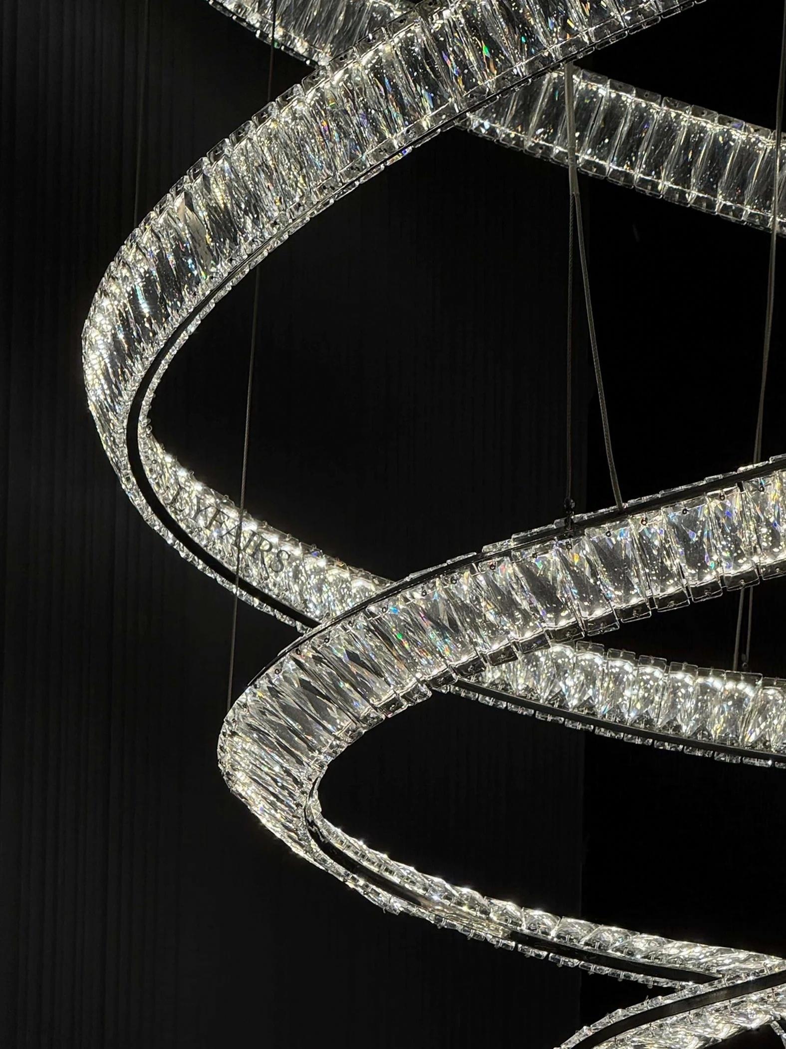 Modern Crystal Light Fixture for Staircase Foyer and High Ceiling close-up of clear crystal LED spiral rings