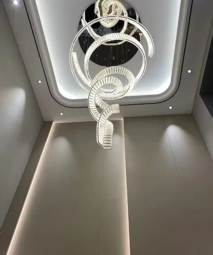 Modern Crystal Light Fixture for Staircase Foyer and High Ceiling viewed from below in a high ceiling hallway