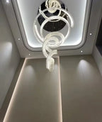 Modern Crystal Light Fixture for Staircase Foyer and High Ceiling viewed from below in a high ceiling hallway
