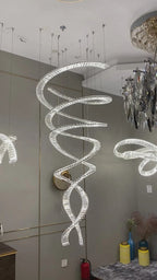 Modern Crystal Light Fixture for Staircase Foyer and High Ceiling installed in a hotel foyer with multiple spiral chandeliers