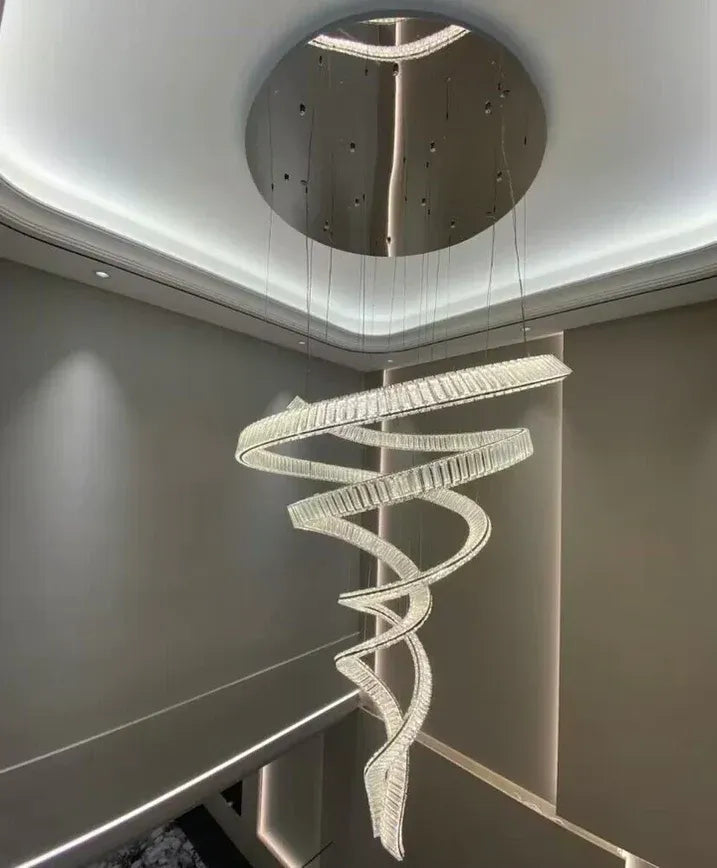 Modern Crystal Light Fixture for Staircase Foyer and High Ceiling with a round ceiling canopy and spiral crystal body
