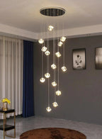 Modern Crystal Square Chandelier for Staircase with black round canopy and clear cube drops in a room corner