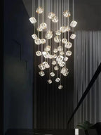 Modern Crystal Square Chandelier for Staircase in a dark stairwell with clustered illuminated cube crystals