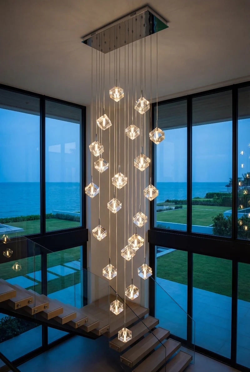 Modern Crystal Square Chandelier for Staircase hanging in a double height space beside tall windows