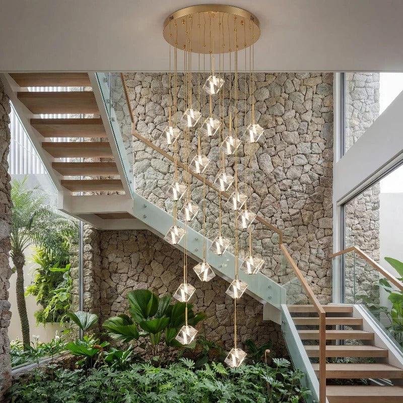 Modern Crystal Square Chandelier for Staircase cascading through a bright stairwell with greenery