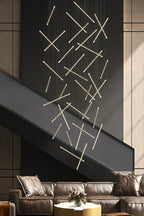 Modern Long Chandelier for High Ceiling & Staircase with stick pendant lights in a contemporary interior