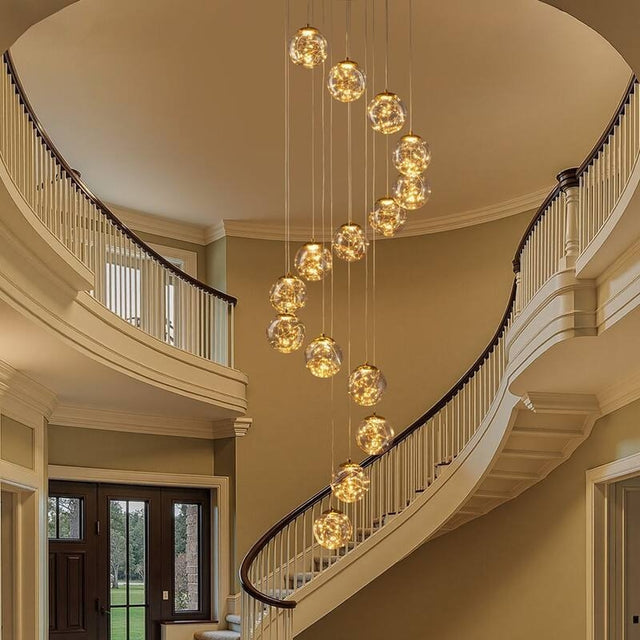 Modern Spiral Chandelier for Staircase installed along a curved foyer staircase