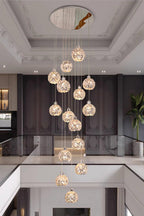 Modern Stainless Steel Petal Chandelier for Staircase hanging through an open stairwell with round crystal petal lights