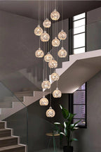 Modern Stainless Steel Petal Chandelier for Staircase with crystal petal pendants installed beside a modern staircase