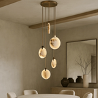 Moonshade Alabaster Disc Stairwell Lighting Chandelier used as a dining room chandelier