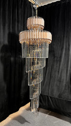 Olivia Crystal Modern Stair Chandelier full length product view with spiral crystal tiers on a black backdrop