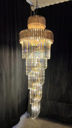 Olivia Crystal Modern Stair Chandelier full product view on a black backdrop with illuminated crystal tiers
