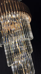 Olivia Crystal Modern Stair Chandelier close-up of hanging crystal prisms and warm LED lights