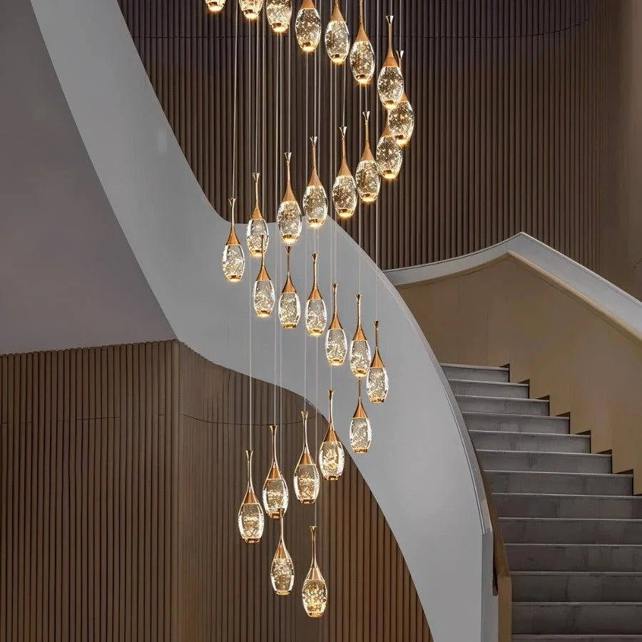 Setya Long Drop Crystal Chandelier installed in a staircase space