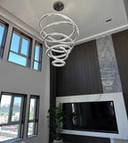 6 Tier Crystal Ring Chandelier for High Ceiling in chrome finish in a high ceiling living room