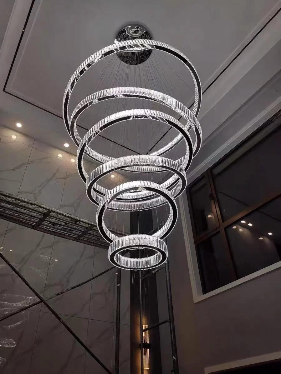 6 Tier Crystal Ring Chandelier for High Ceiling in chrome finish in a modern hallway installation