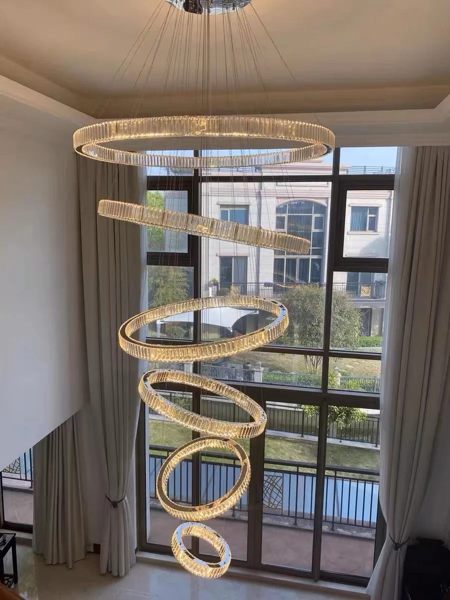6 Tier Crystal Ring Chandelier for High Ceiling gold ring design installed by a tall window