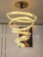 6 Tier Crystal Ring Chandelier for High Ceiling gold finish shown against a wall with crystal ring tiers