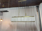 Solstice Alabaster Linear Bar Chandelier with gold frame, unlit front view