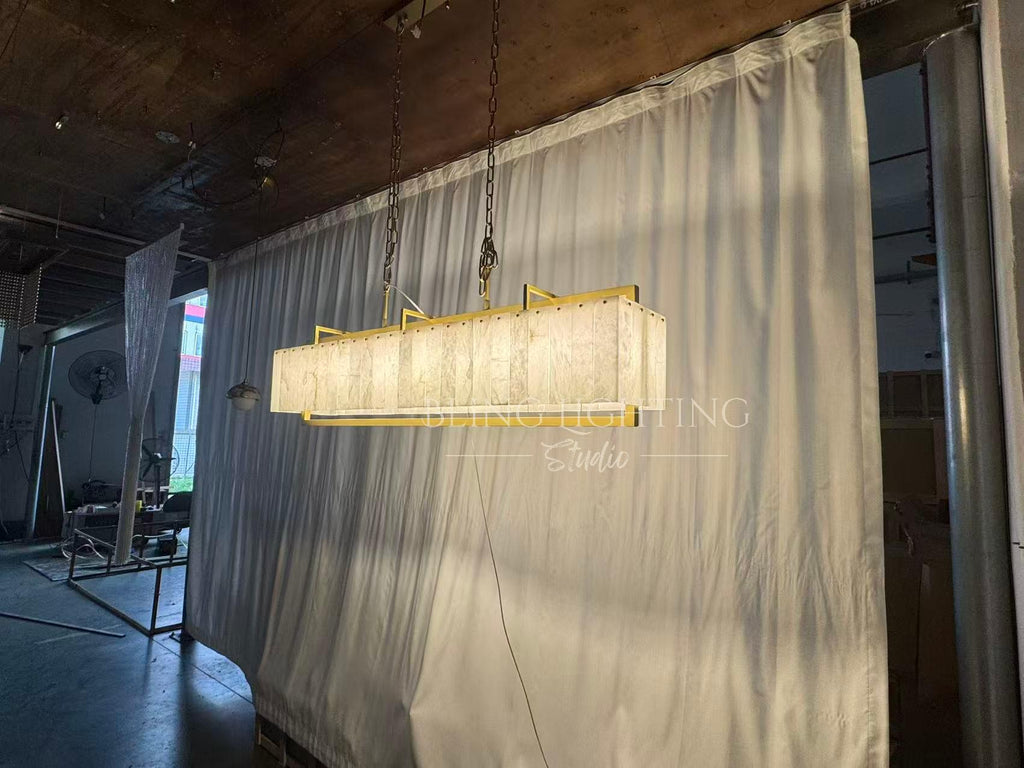 Solstice Alabaster Linear Bar Chandelier illuminated angled room view