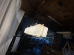 Solstice Alabaster Linear Bar Chandelier illuminated side view showing alabaster panels