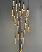 Spiral Raindrop Staircase Ceiling Lighting installed as a cascading chandelier in a high ceiling space