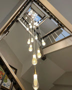 Spiral Raindrop Staircase Ceiling Lighting installed in a tall staircase foyer