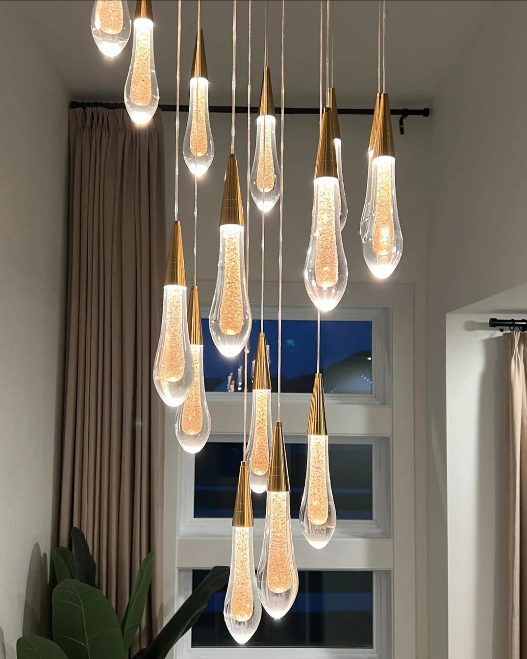 Spiral Raindrop Staircase Ceiling Lighting for a staircase with round cascading crystal pendants