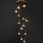 Tenza Modern Staircase Chandelier with clear glass pendants cascading from a round ceiling plate
