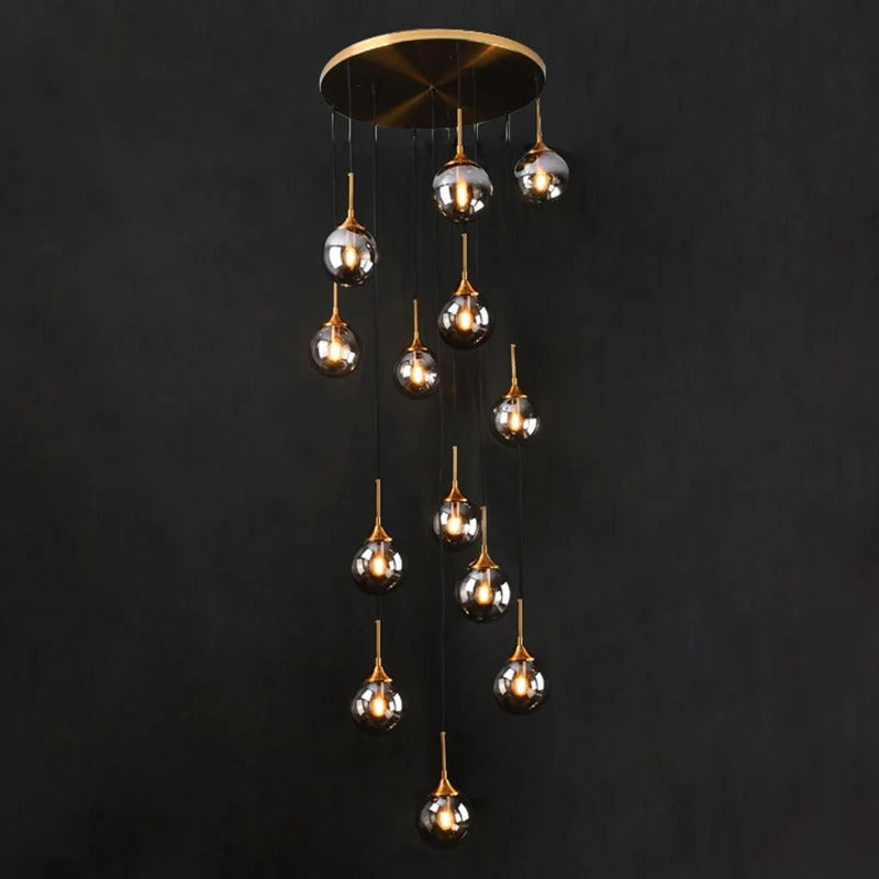 Tenza Modern Staircase Chandelier with clear glass ball pendants arranged in a spiral 9 light design