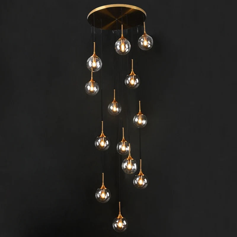 Tenza Modern Staircase Chandelier with smoky glass ball pendants and warm integrated lights