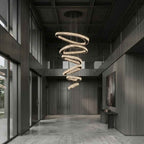 Twisted Ring Crystal Led Light Chandelier for High Ceiling in a foyer with cascading illuminated rings