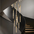 Uly Gold Crystal Chandelier for Staircase and High Ceiling with cascading crystal rods along a curved stairway