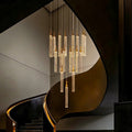 Uly Gold Crystal Chandelier for Staircase and Foyer installed beside a curved staircase
