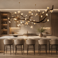 Wanos Ceramic Flower Branch Chandelier above a luxury marble kitchen island with warm wood cabinetry, soft ambient lighting, and a refined branch design.