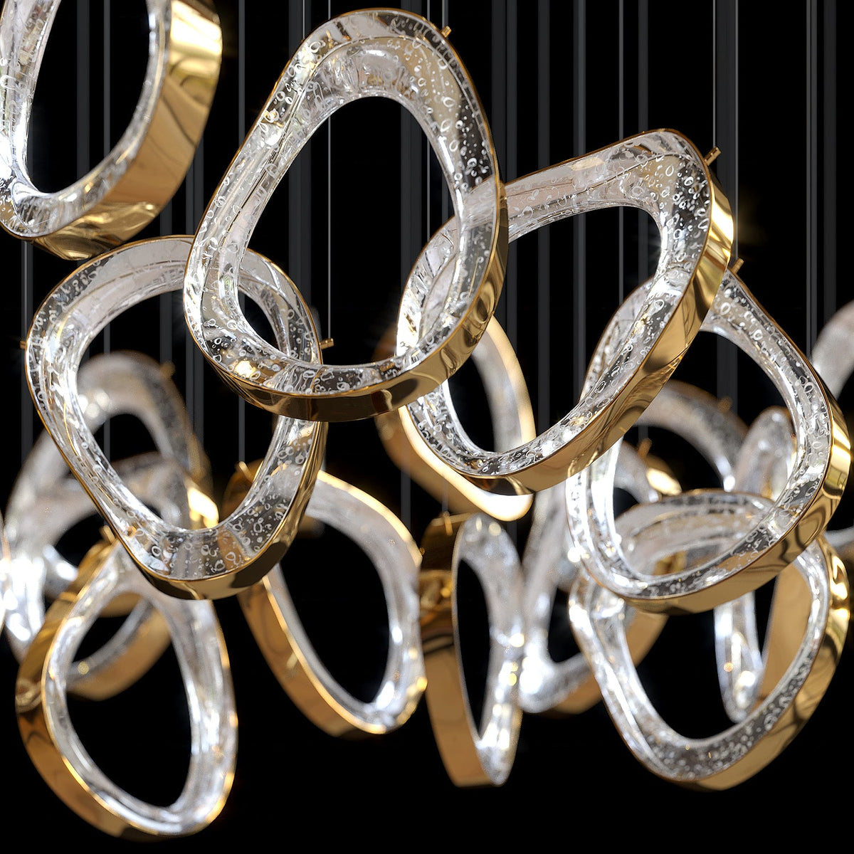 Gold Crystal Loop Chandelier chandelier in a tall interior