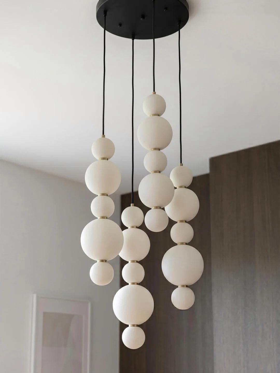 White Multi Globe Pendant Light for Staircase and High Ceiling close product view of opal glass globe strands